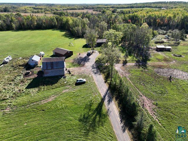 8353 Mannik Road Iron River, WI 54847 - Photo 4 of 52 Aerial view of property and surrounding area featuring rural landscape