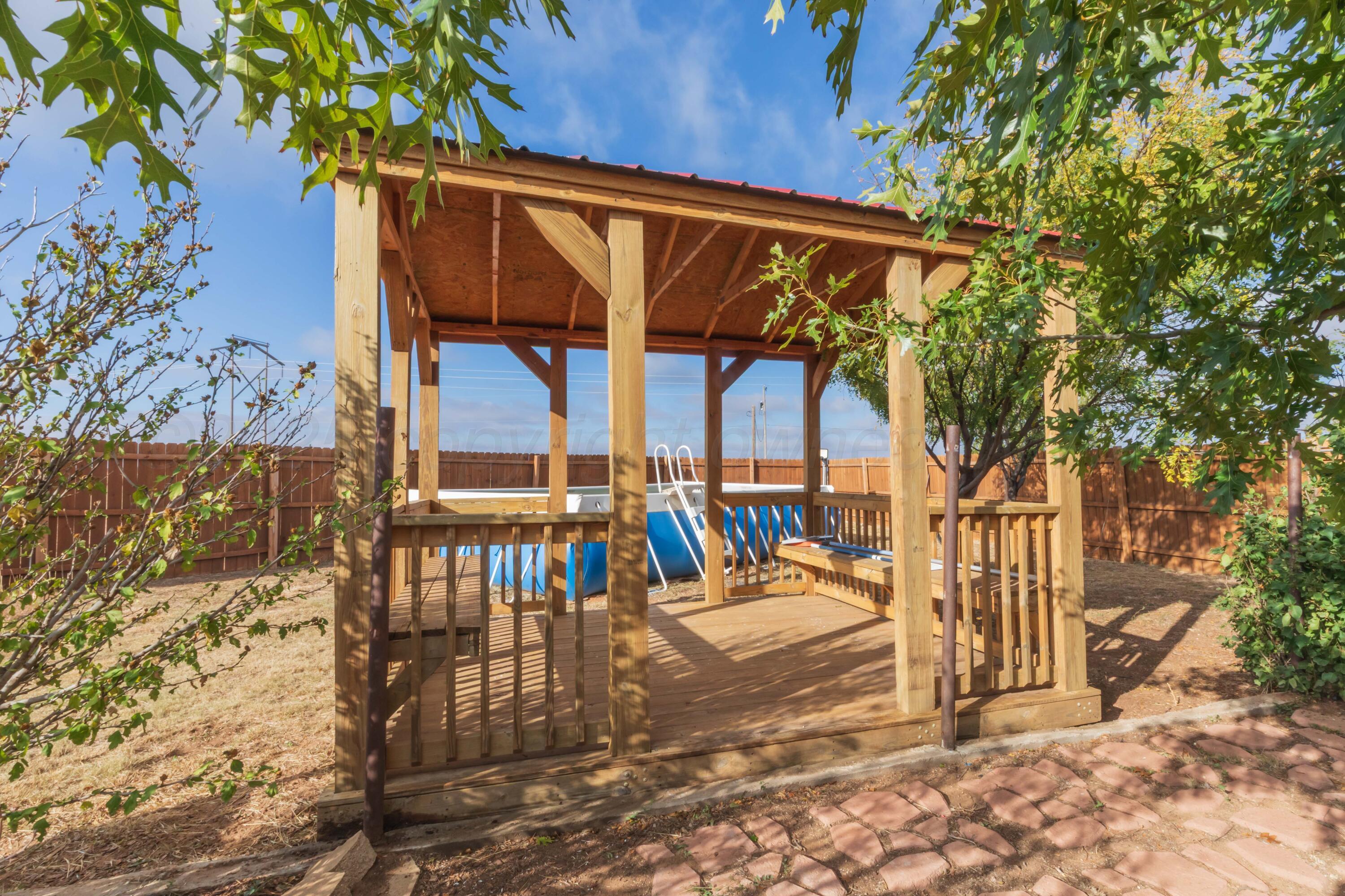 22701 South Blessen Road Canyon, TX 79015 - Photo 26 of 32 a view of a patio with a table and chairs and potted plants