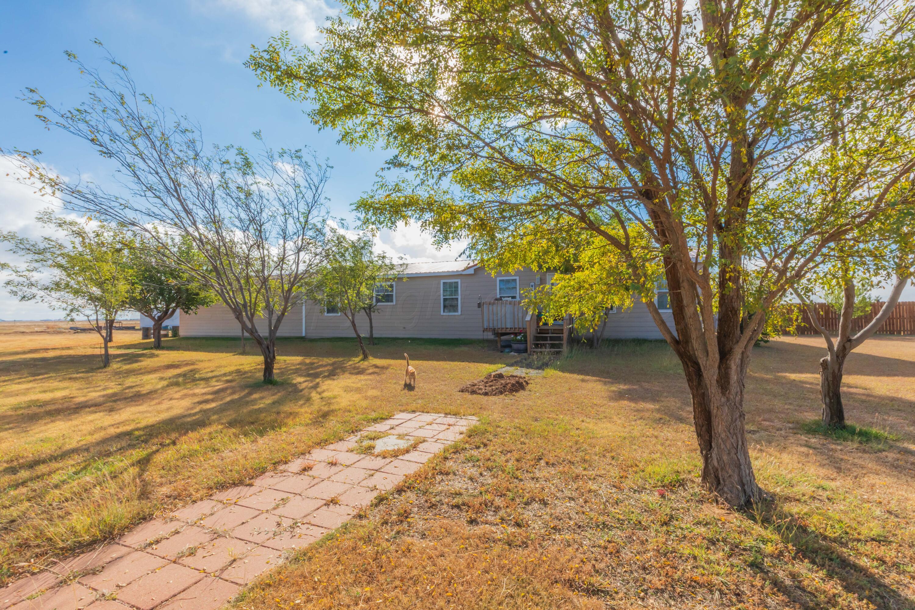 22701 South Blessen Road Canyon, TX 79015 - Photo 31 of 32 a view of a yard with trees