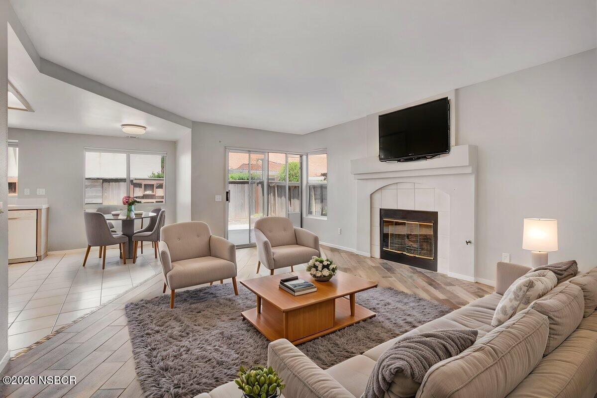 1248 Stonebrook Drive Lompoc, CA 93436 - Photo 11 of 38 a living room with furniture fireplace and a flat screen tv