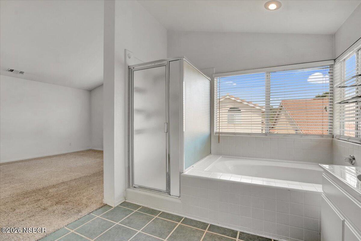 1248 Stonebrook Drive Lompoc, CA 93436 - Photo 25 of 38 a bathroom with a bathtub and a shower