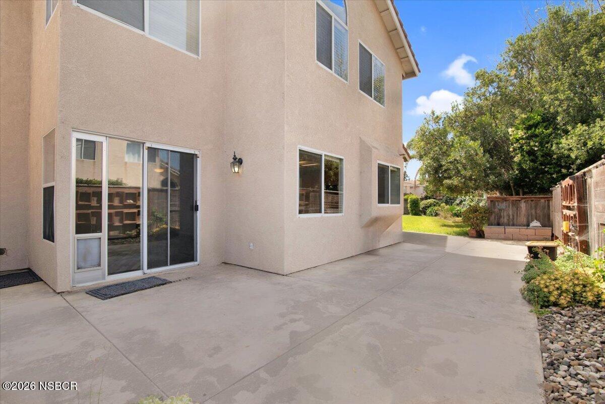 1248 Stonebrook Drive Lompoc, CA 93436 - Photo 33 of 38 a view of a house with backyard and a tree