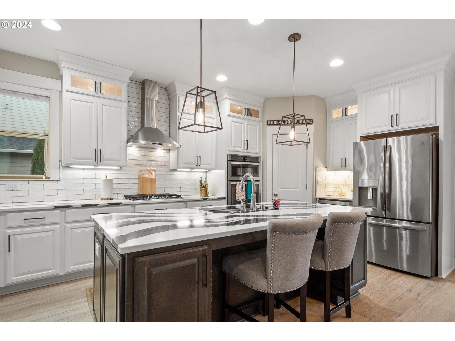 2804 Northeast 167th Circle Ridgefield, WA 98642 - Photo 11 of 36 a kitchen with stainless steel appliances granite countertop a sink a stove a refrigerator and island