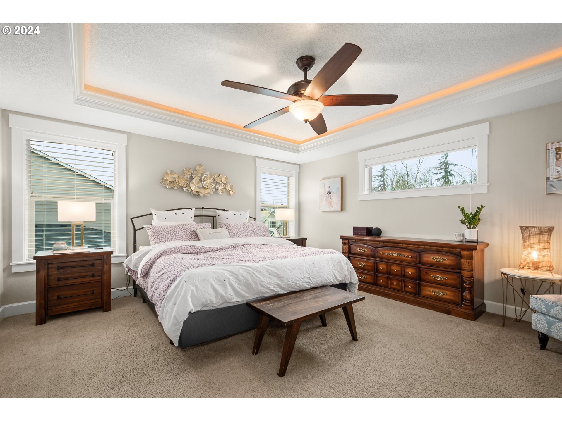 2804 Northeast 167th Circle Ridgefield, WA 98642 - Photo 17 of 36 a bedroom with a bed and a chandelier