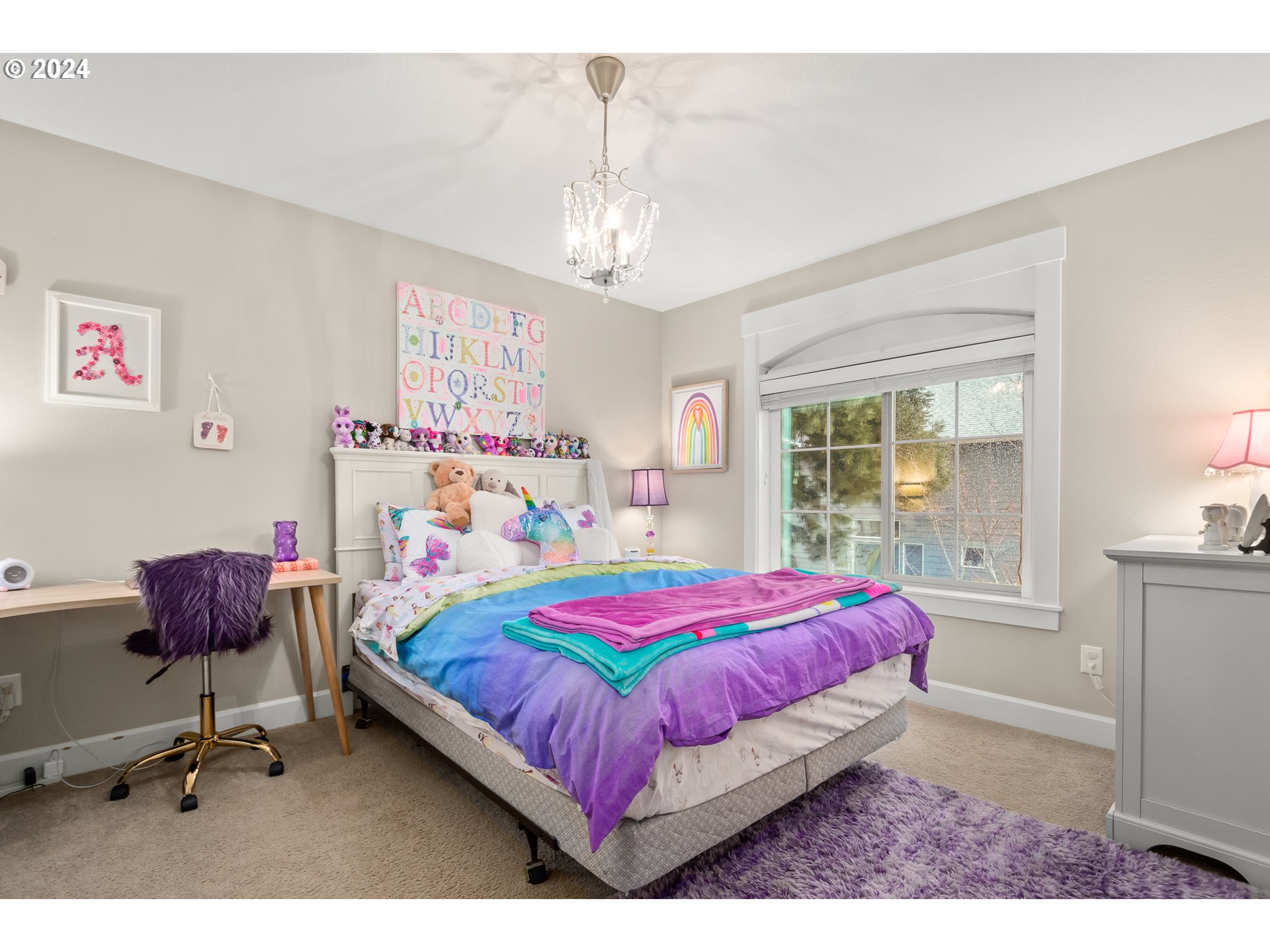 2804 Northeast 167th Circle Ridgefield, WA 98642 - Photo 24 of 36 a bedroom with a bed a desk and chair with the bookshelf