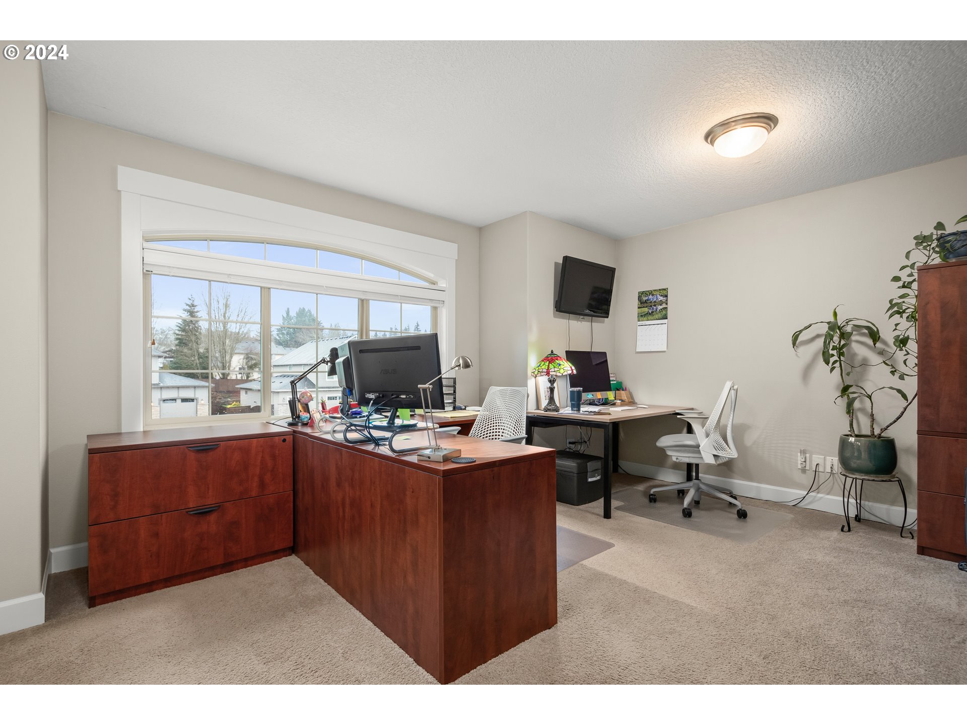 2804 Northeast 167th Circle Ridgefield, WA 98642 - Photo 25 of 36 a living room with furniture a flat screen tv and a window