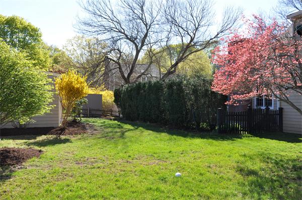 36 Coolidge Road Milton, MA 02186 - Photo 8 of 12 a backyard of a house with lots of green space