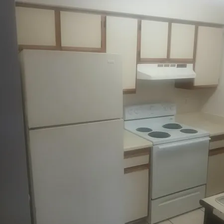 a view of storage and utility room with washer and dryer
