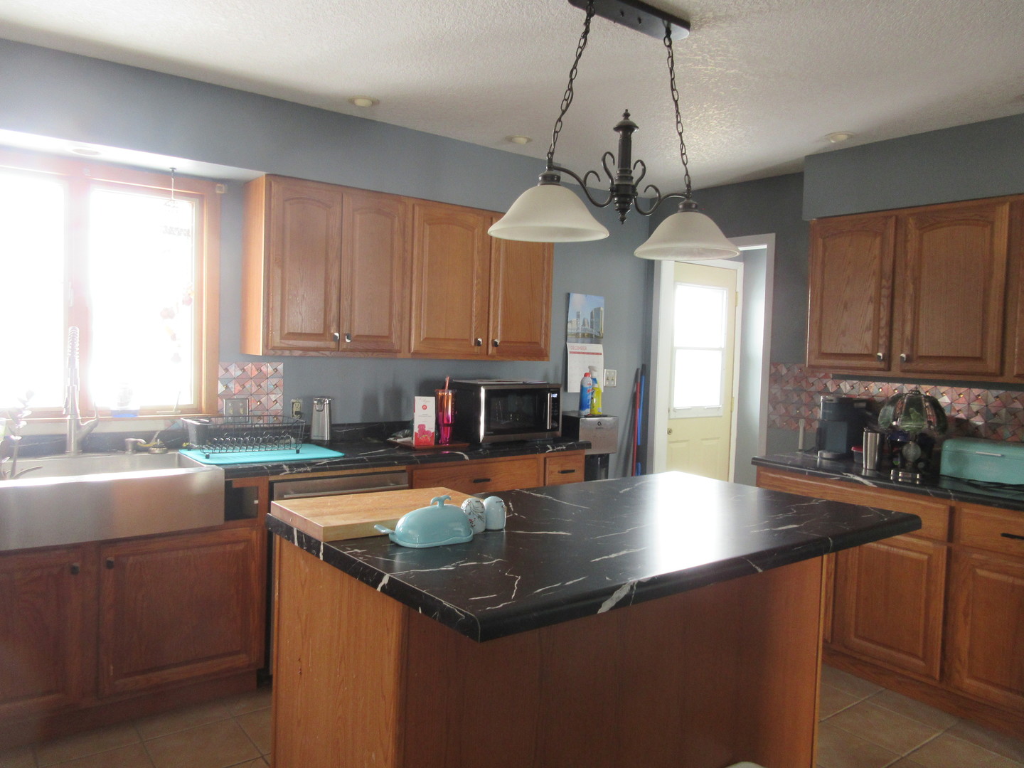 20172 Prophet Road Prophetstown, IL 61277 - Photo 2 of 32 a kitchen with stainless steel appliances granite countertop a sink a stove and cabinets