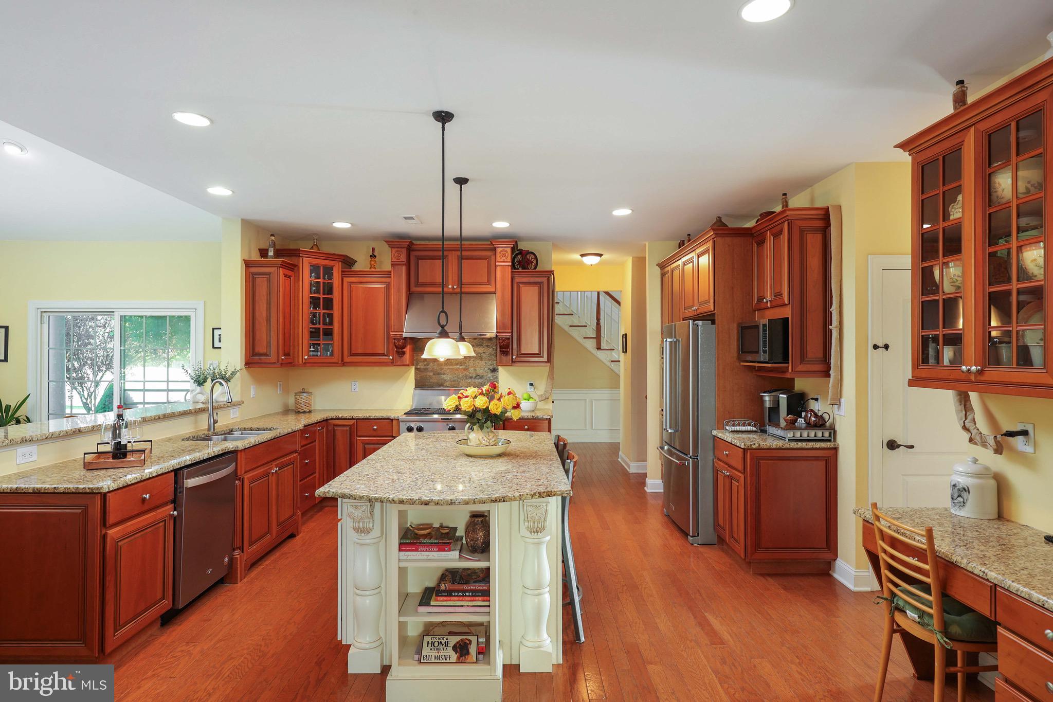 15 Manchester Court Columbus, NJ 08022 - Photo 12 of 80 a open kitchen with stainless steel appliances granite countertop a sink dishwasher stove refrigerator and cabinets with wooden floor