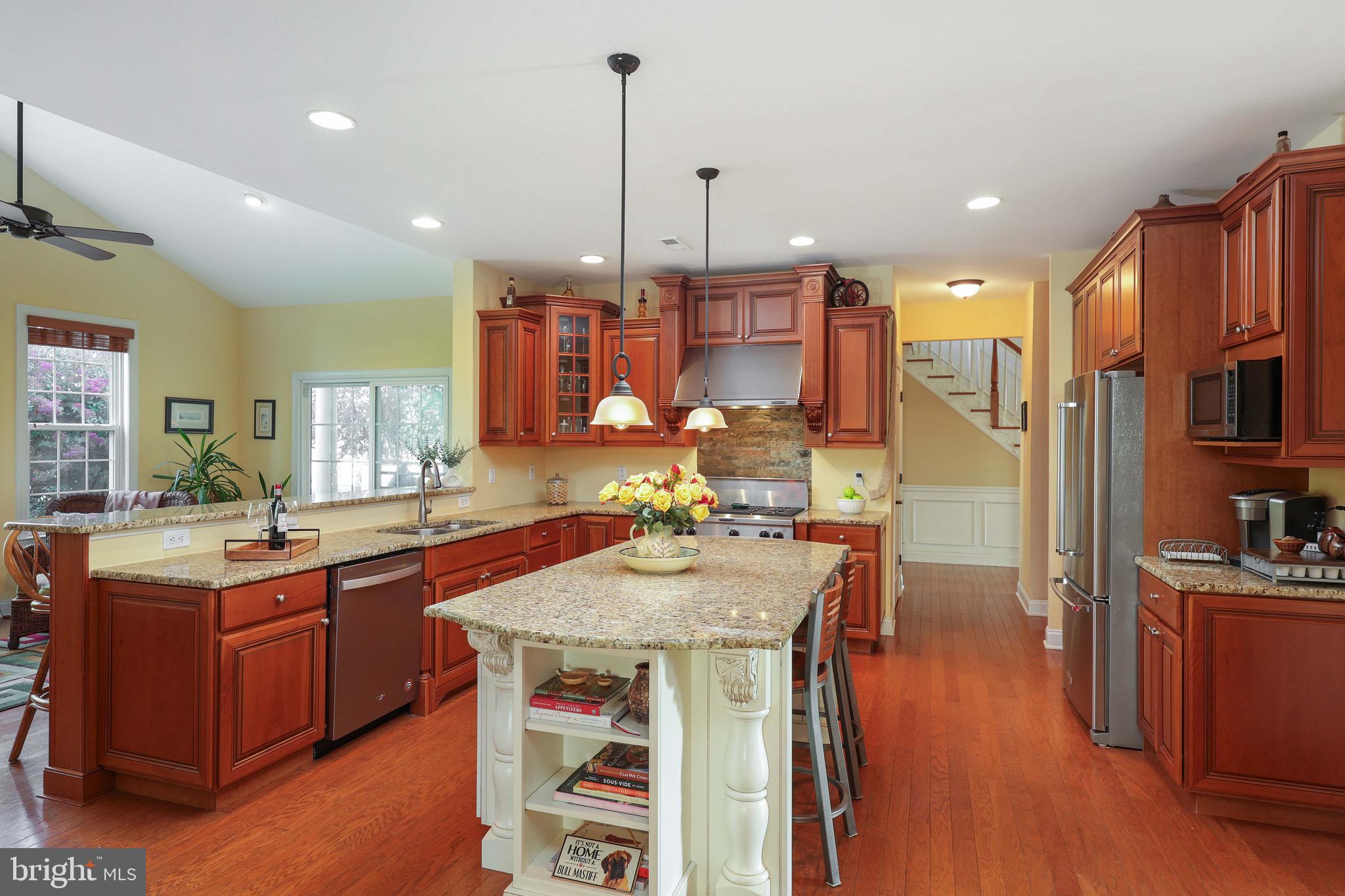 15 Manchester Court Columbus, NJ 08022 - Photo 15 of 80 a kitchen with stainless steel appliances granite countertop a sink a stove and a wooden floors