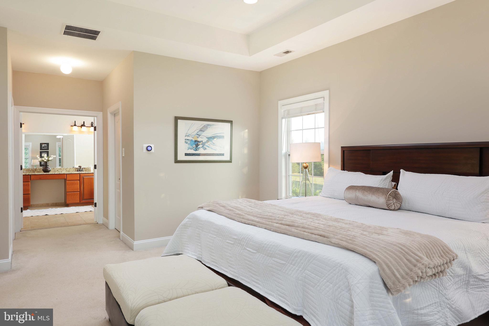 15 Manchester Court Columbus, NJ 08022 - Photo 24 of 80 a bedroom with a large bed and a chandelier