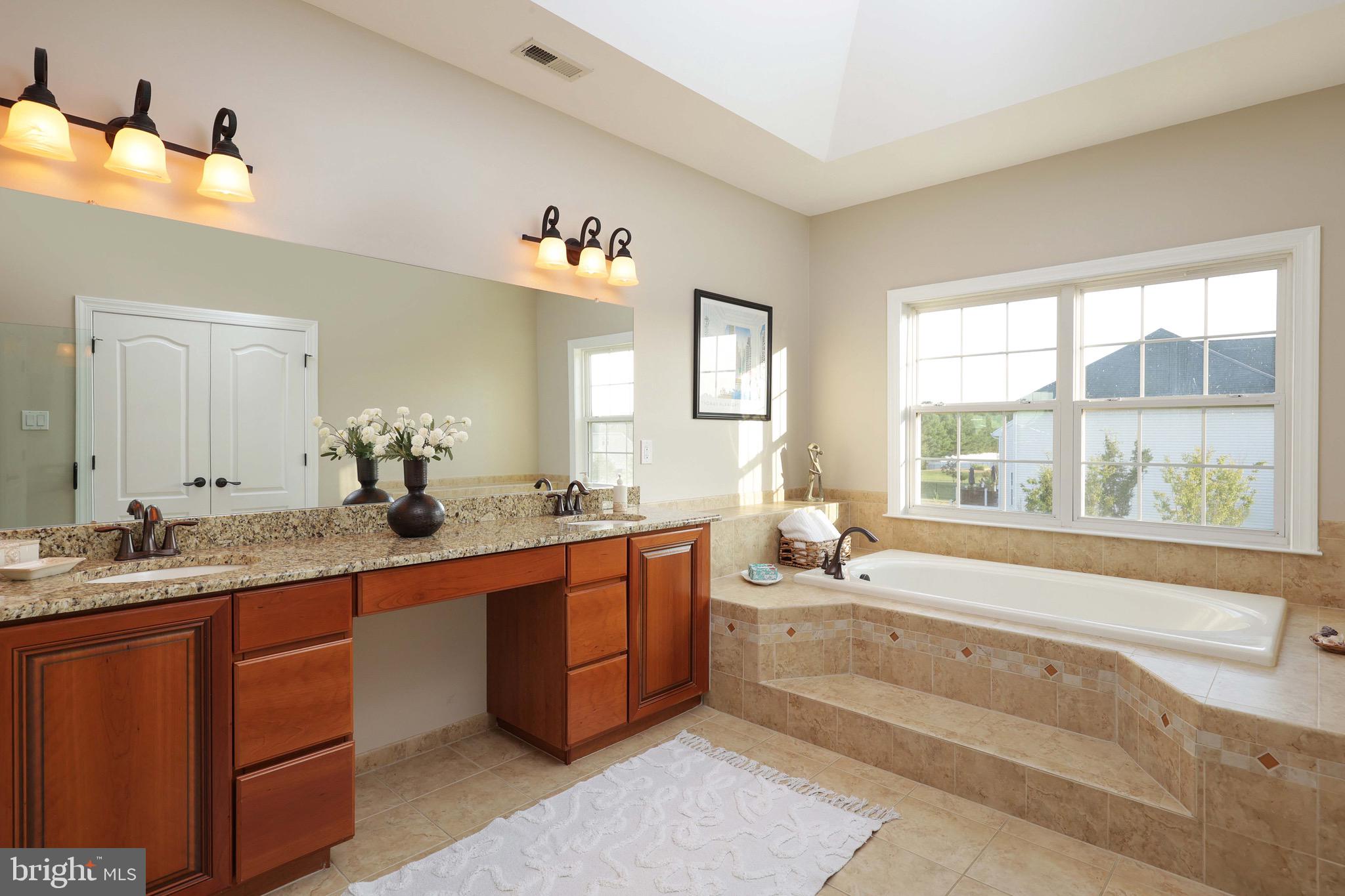 15 Manchester Court Columbus, NJ 08022 - Photo 26 of 80 a large white bathroom with a large tub sink and double vanity