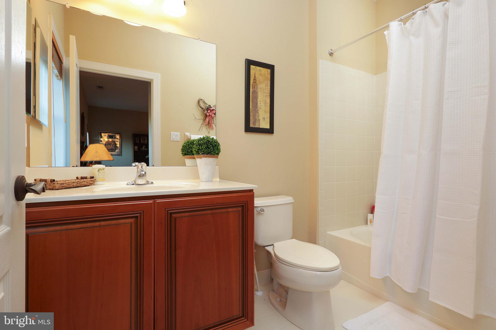 15 Manchester Court Columbus, NJ 08022 - Photo 34 of 80 a bathroom with a sink a toilet and mirror