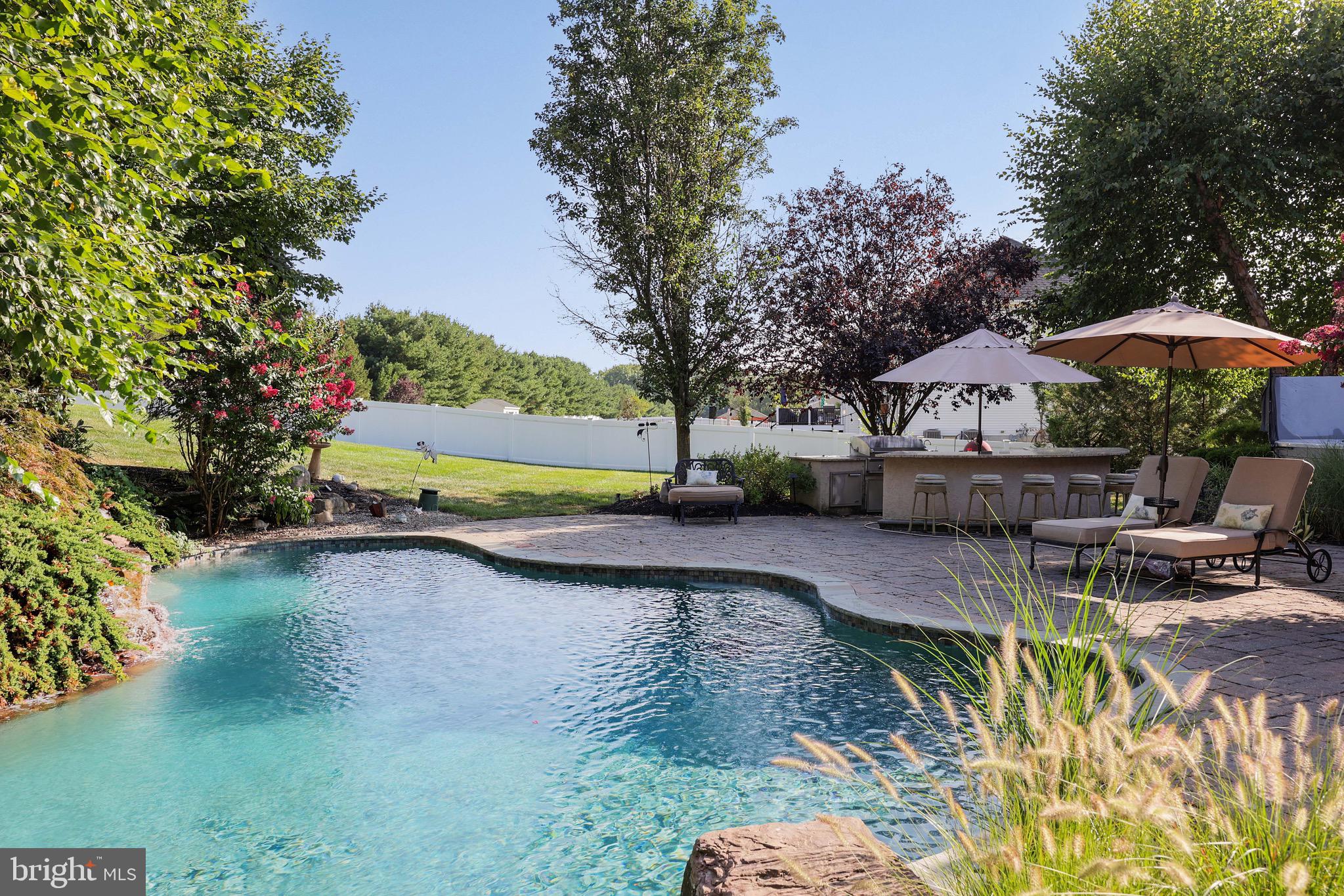 15 Manchester Court Columbus, NJ 08022 - Photo 46 of 80 a view of a patio with table and chairs under an umbrella