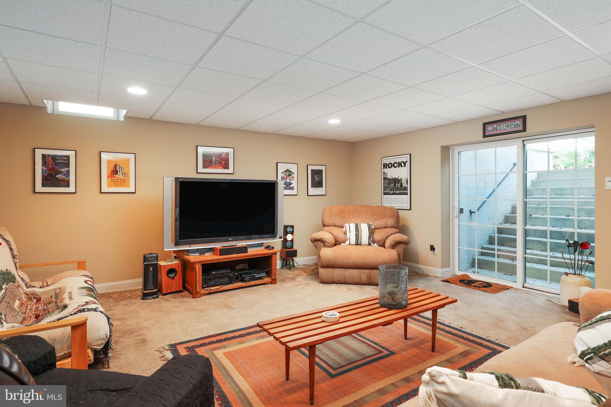 15 Manchester Court Columbus, NJ 08022 - Photo 52 of 80 a living room with furniture and a flat screen tv