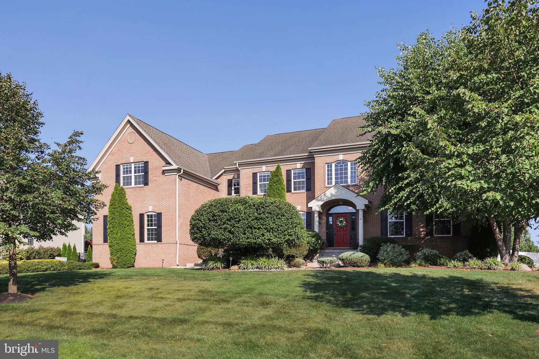 15 Manchester Court Columbus, NJ 08022 - Photo 63 of 80 a front view of a house with a yard and garage