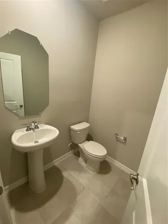a bathroom with a sink a toilet