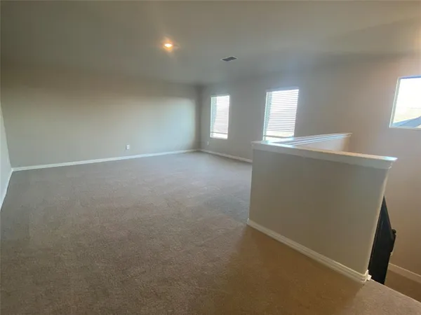 a view of an empty room and closet area