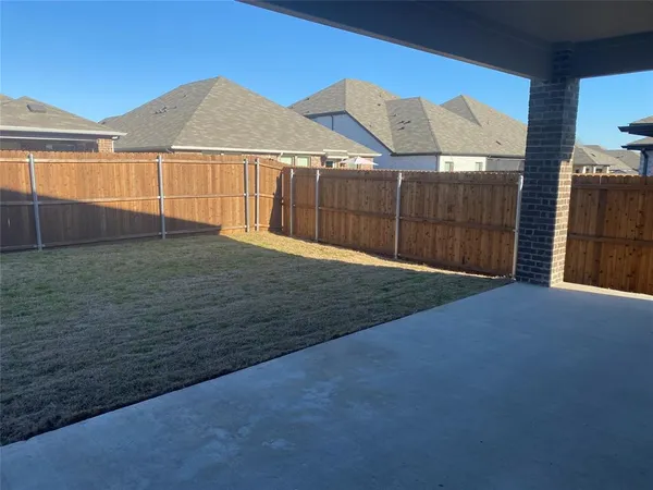 a view of a backyard of the house