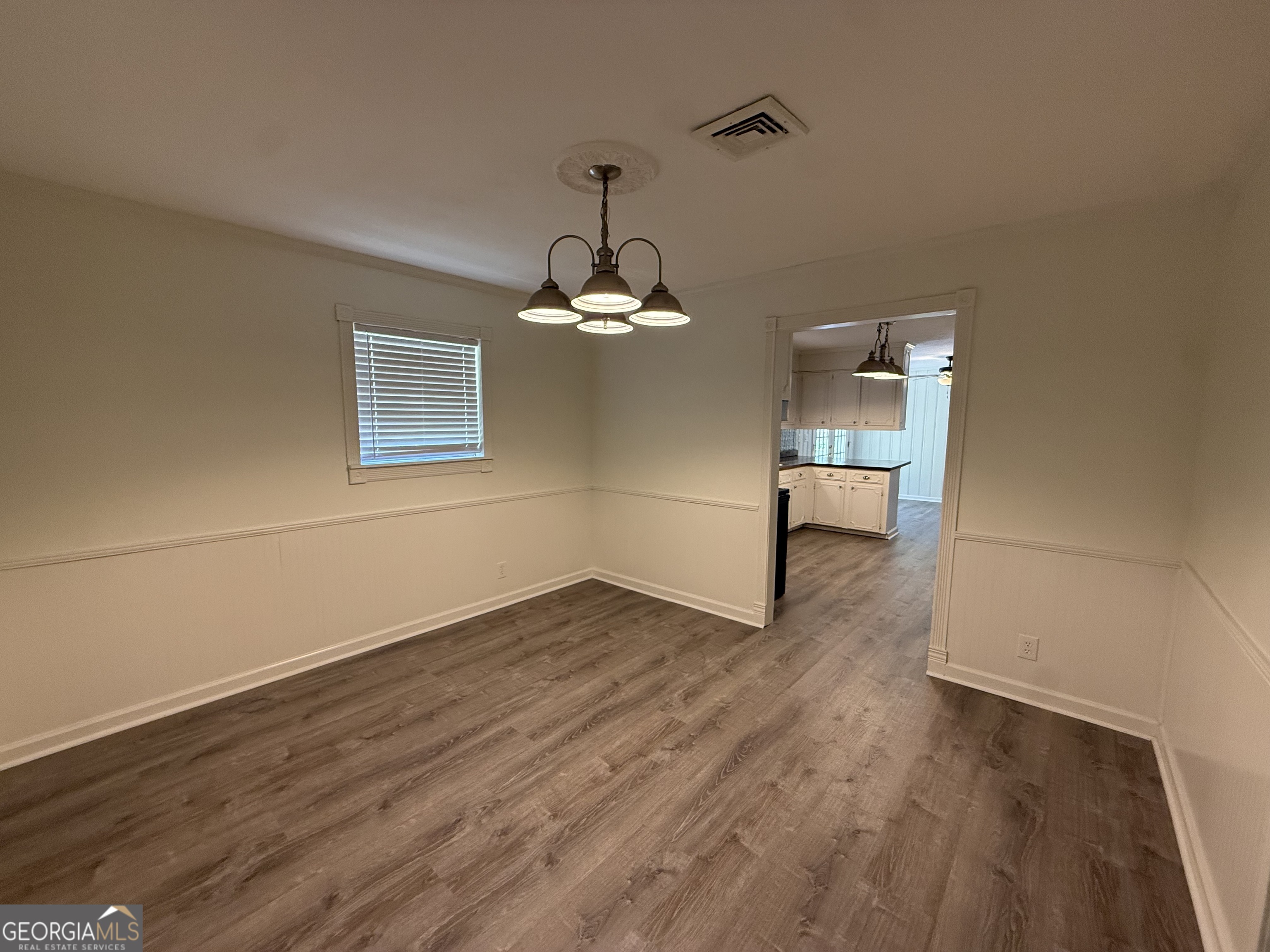 108 Plum Street Dublin, GA 31021 - Photo 14 of 33 a view of a room with wooden floor and a window