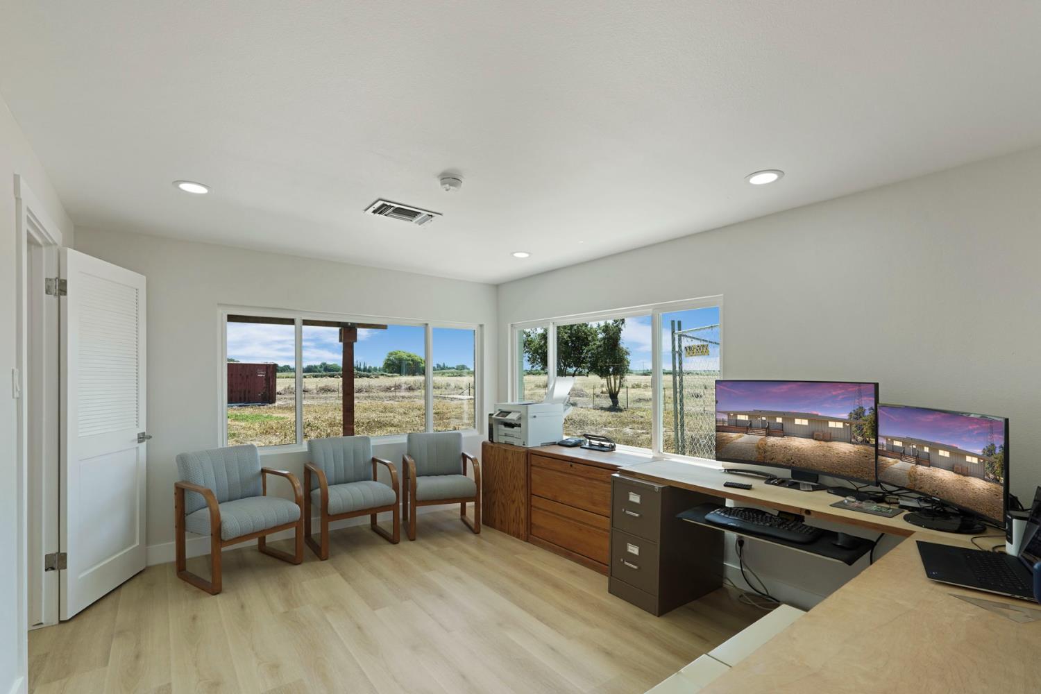 2650 West Twitchell Island Road Rio Vista, CA 94571 - Photo 56 of 60 a kitchen with stainless steel appliances granite countertop a stove and white cabinets