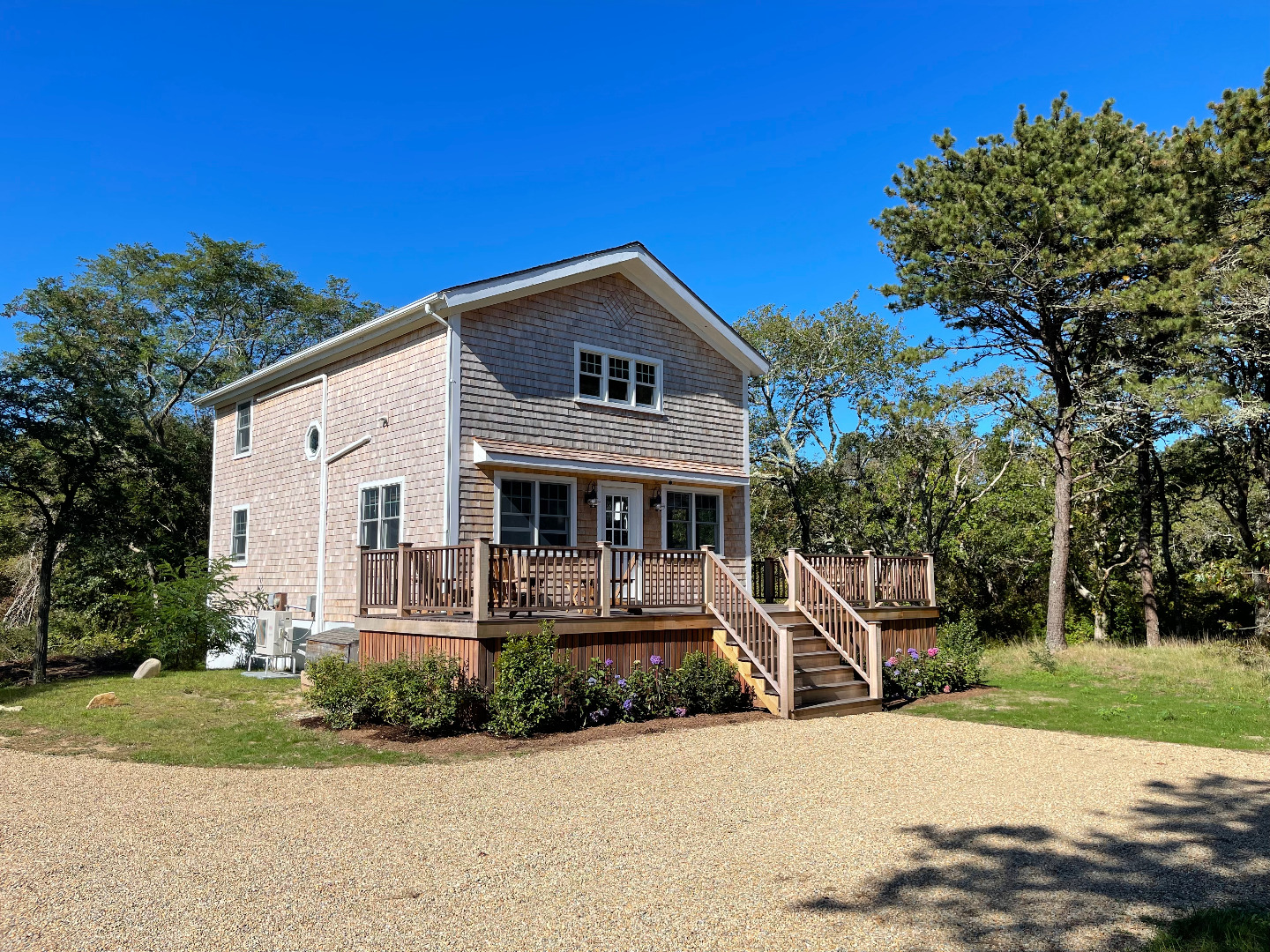 300 Chappaquiddick Road Edgartown, MA 02539 - Photo 1 of 16 a front view of house with yard and green space