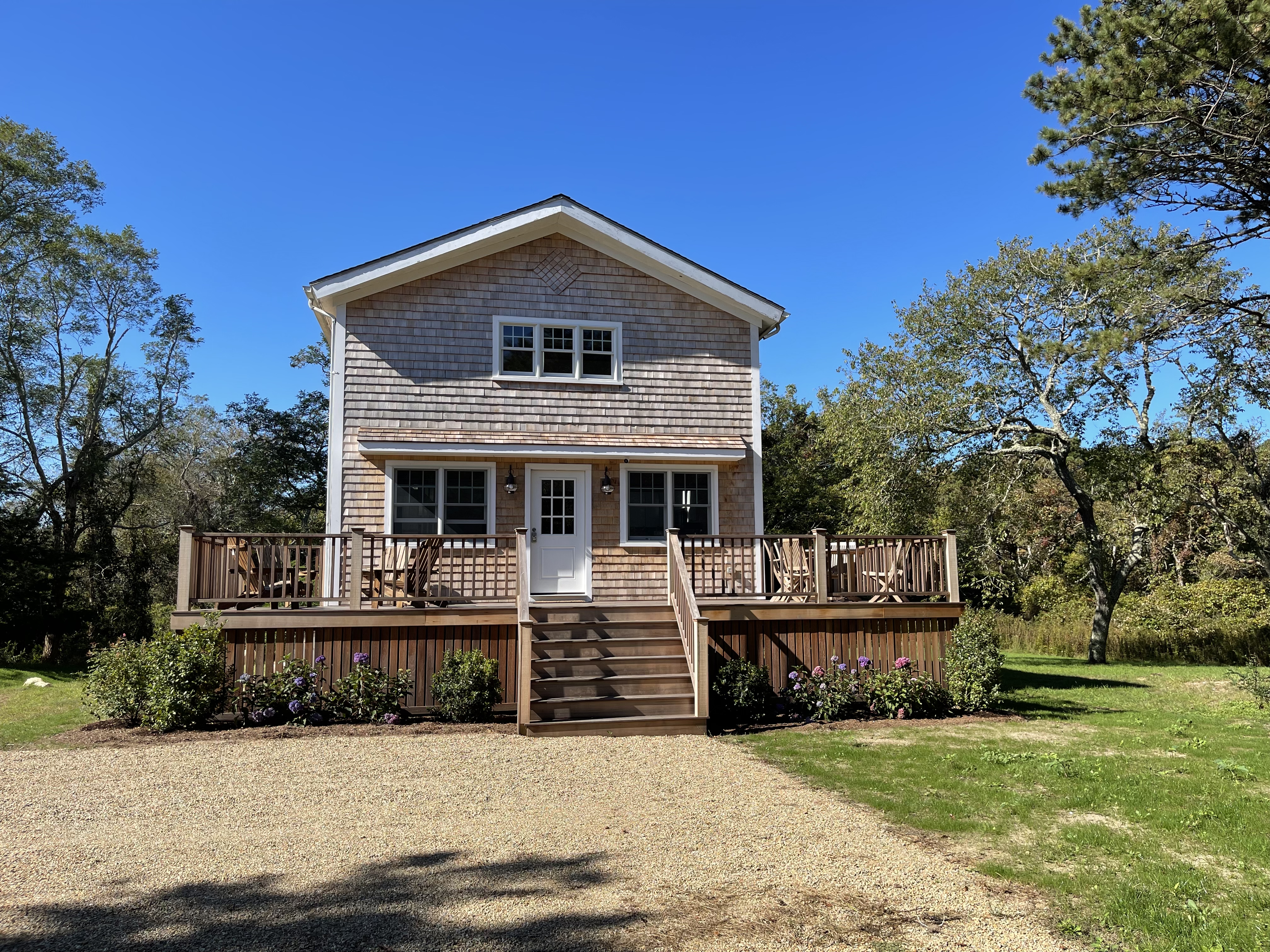 300 Chappaquiddick Road Edgartown, MA 02539 - Photo 2 of 16 a front view of a house with a yard