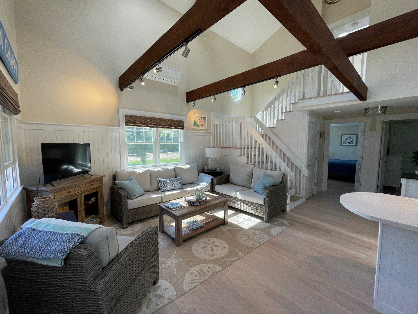 300 Chappaquiddick Road Edgartown, MA 02539 - Photo 3 of 16 a living room with furniture and a flat screen tv