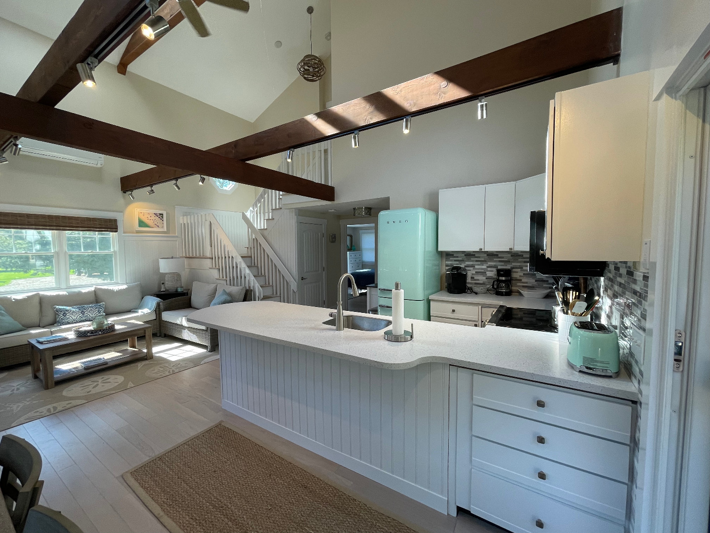 300 Chappaquiddick Road Edgartown, MA 02539 - Photo 5 of 16 a kitchen with a refrigerator a stove and a sink with wooden floor