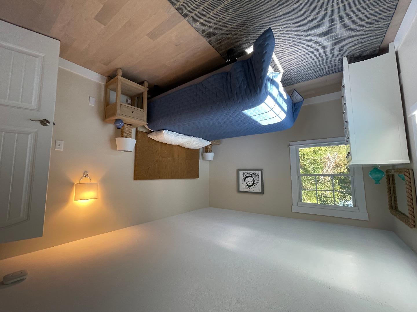 300 Chappaquiddick Road Edgartown, MA 02539 - Photo 8 of 16 a bedroom with a bed and a window