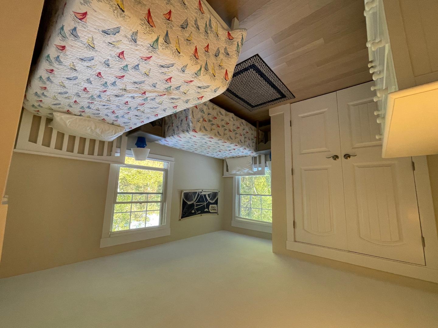 300 Chappaquiddick Road Edgartown, MA 02539 - Photo 9 of 16 a bedroom with two beds and a window