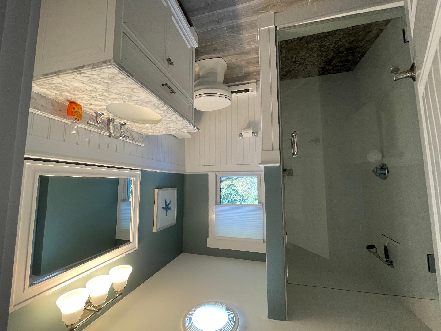 300 Chappaquiddick Road Edgartown, MA 02539 - Photo 10 of 16 a bathroom with a granite countertop sink toilet and shower