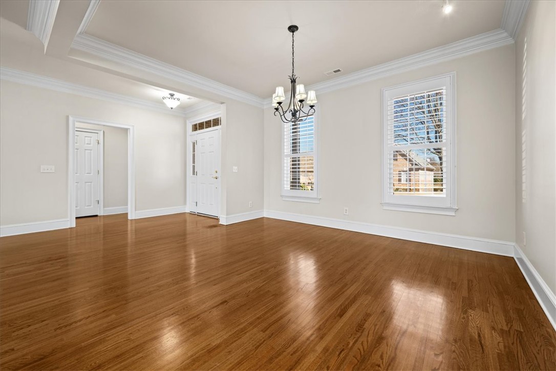 38 Angus Run Seneca, SC 29672 - Photo 8 of 46 This airy space features hardwood floors and elegant crown molding, creating a welcoming atmosphere.
