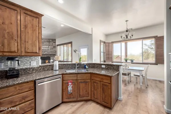 a kitchen with lots of counter top space and sink