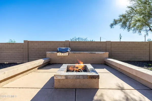a view of a terrace with couches and sky view
