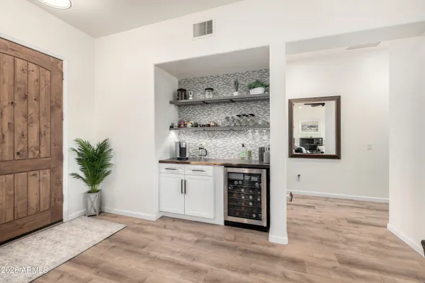 a view of kitchen with sink and cabinets