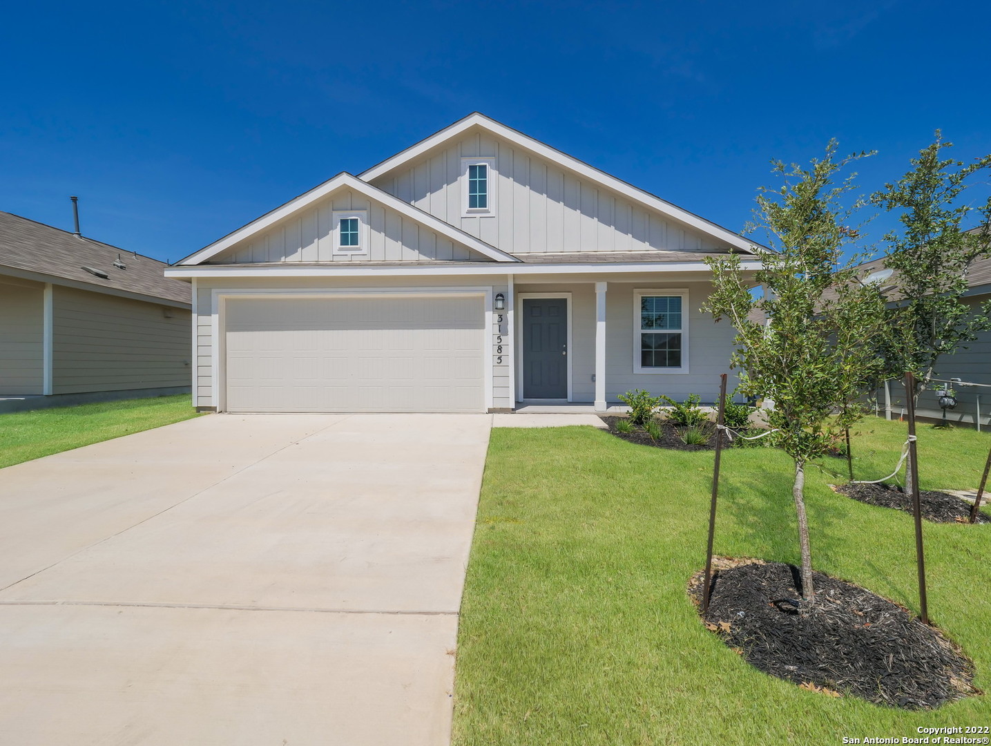 13234 Wrangler Street Corpus Christi, TX 78410 - Photo 1 of 1 a front view of a house with a yard and trees