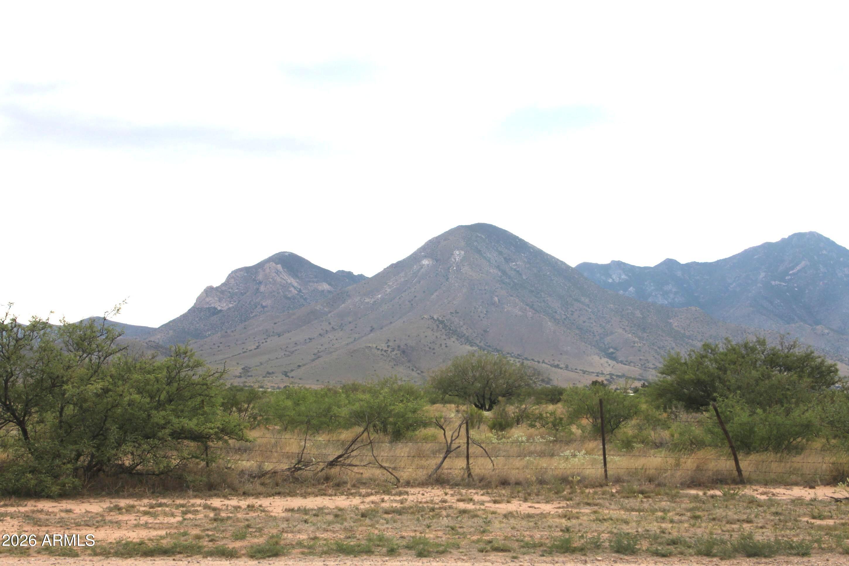 10847 South Kings Ranch Road Hereford, AZ 85615 - Photo 42 of 49 a view of a lake with mountains in the background