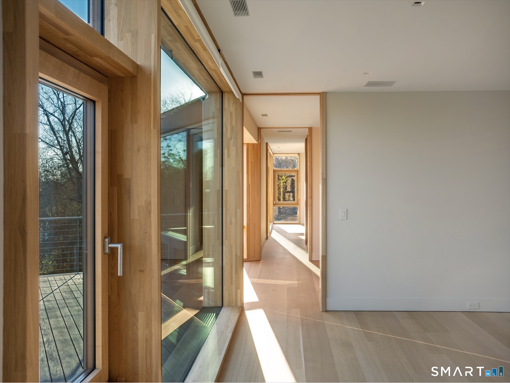 314 Ferry Road Old Lyme, CT 06371 - Photo 21 of 40 Floor-to-ceiling windows continue onto second floor.