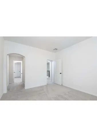 a kitchen with a sink and a refrigerator