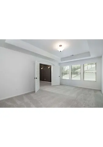 a black and white photo of a living room