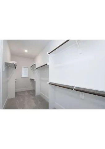 a bathroom with a tub sink shower and mirror