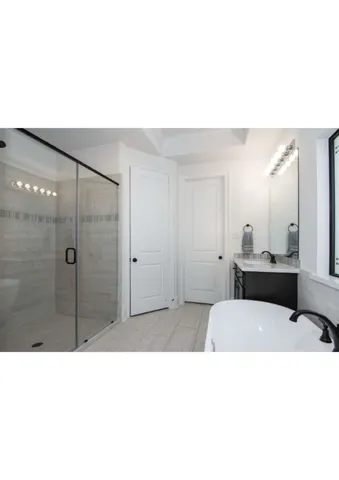 a open kitchen with cabinets a sink and a stove