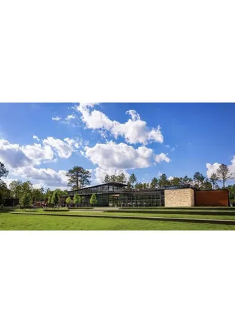 a view of parking with cars parked