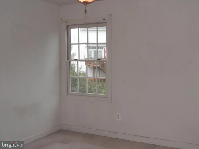a view of empty room with windows