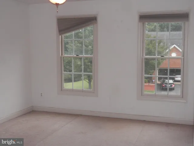a bathroom with a shower a toilet and sink