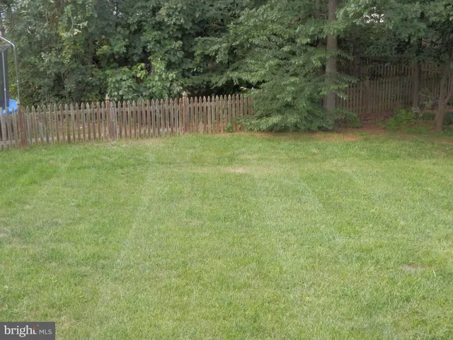 a view of a wooden fence