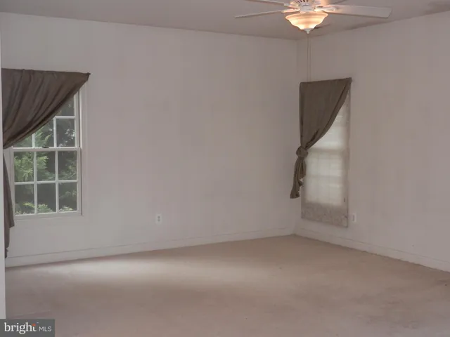 a bath tub sitting next to a window