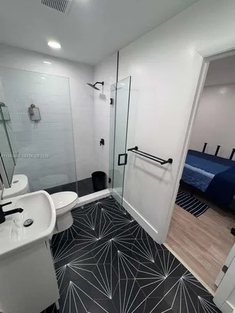 a bathroom with a sink and a toilet